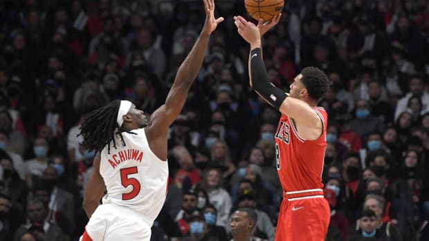 Oct 25, 2021; Toronto, Ontario, CAN; Chicago Bulls guard Zach LaVine (8) shoots the ball as Toronto Raptors forward Precious Achiuwa (5) defends in the first half at Scotiabank Arena. Mandatory Credit: Dan Hamilton-USA TODAY Sports